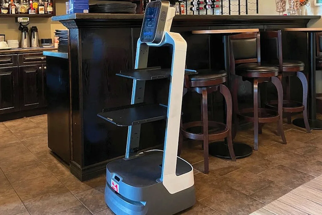 AI service robot prepared for food delivery in a restaurant